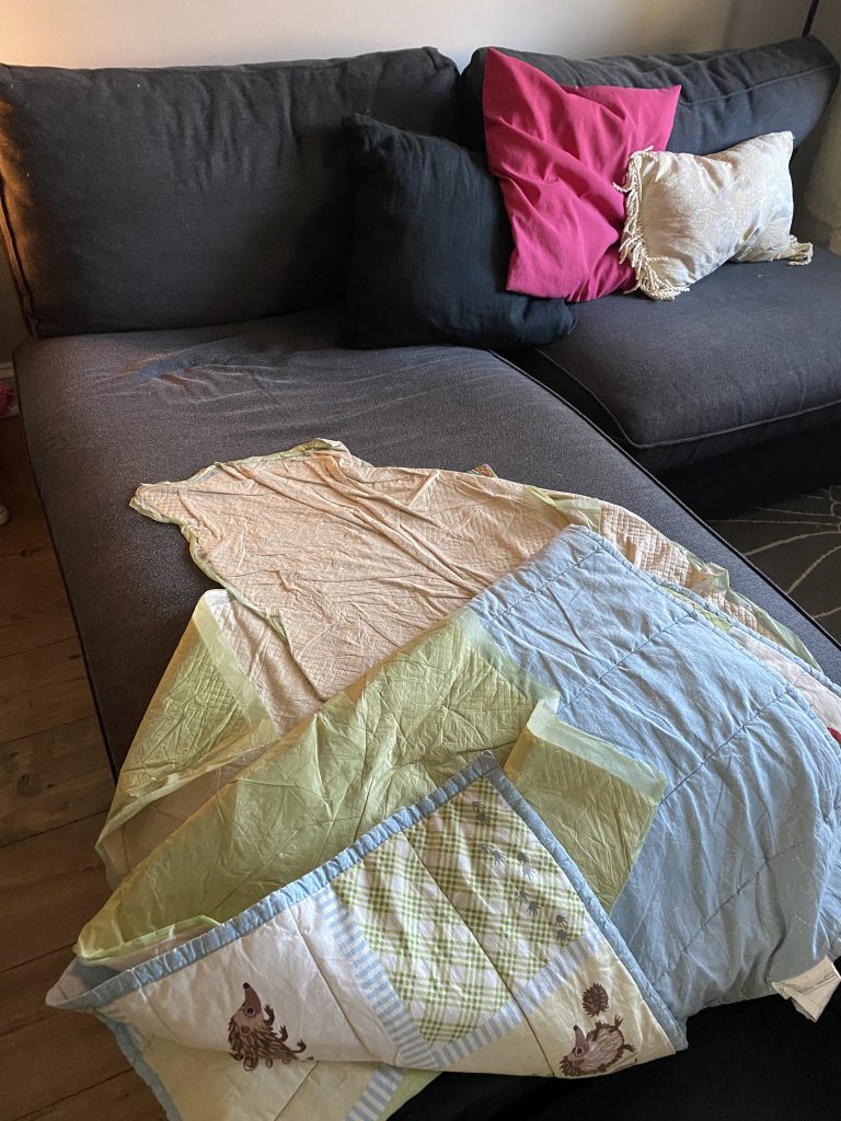 a messy blanket on couch